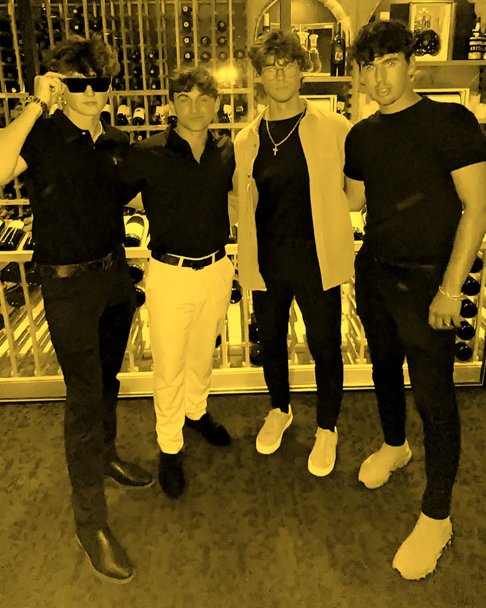 Four team members in black at dinner