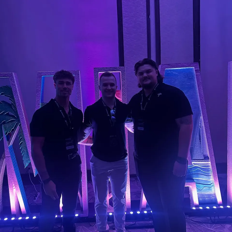 Three teammates at the Pinnacle summit in Miami