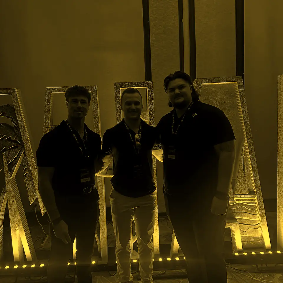 Three teammates at the Pinnacle summit in Miami
